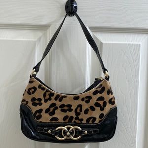 Wilson’s leather black and leopard print purse.
